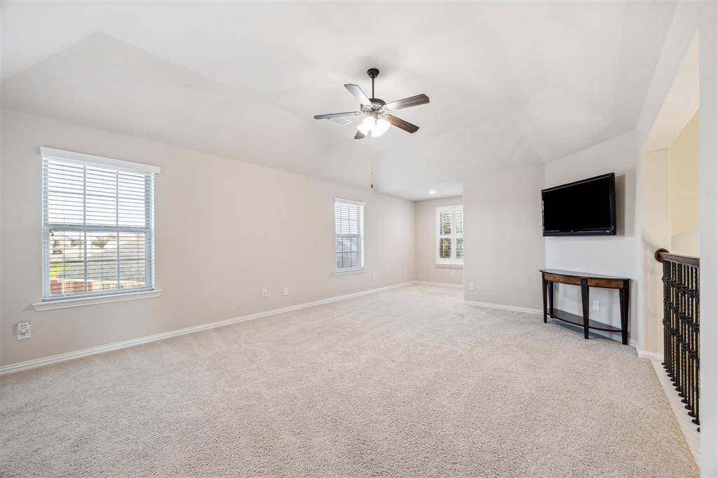 Expansive game room with cozy reading nook.