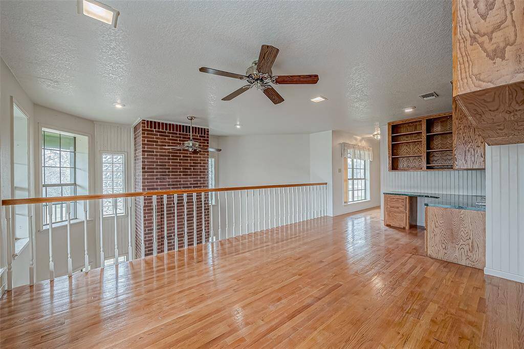 Overlooking the main living space below, the loft keeps the upper and lower levels connected while maintaining a sense of privacy.