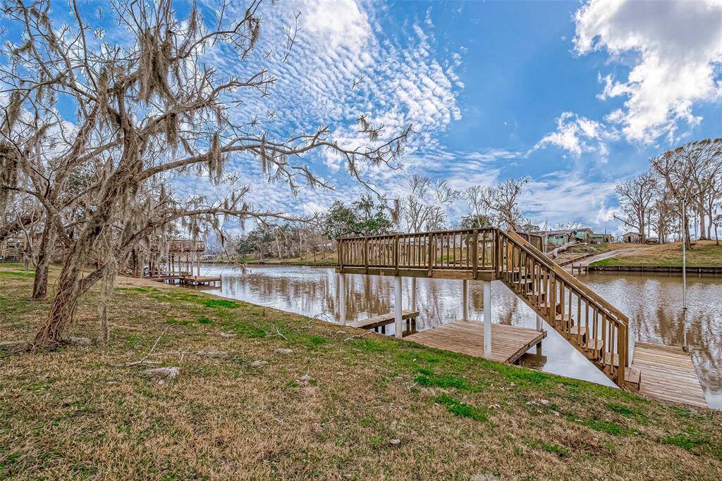 Nestled at the water’s edge, this spacious wooden deck extends over the river, offering direct access for boating, fishing, or simply enjoying the view.