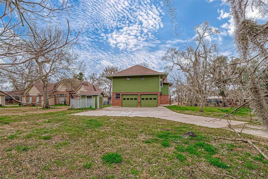 The surrounding trees provide a natural frame, enhancing the home’s connection to the outdoors.