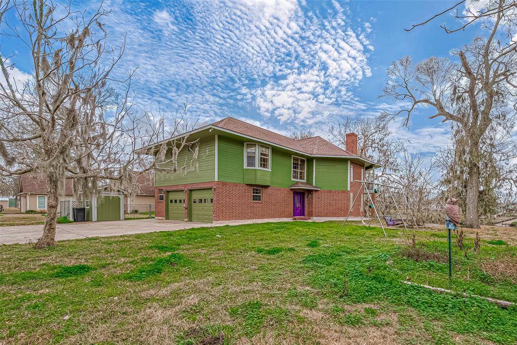 A sprawling grassy lot stretches out in every direction, offering endless possibilities for outdoor enjoyment.