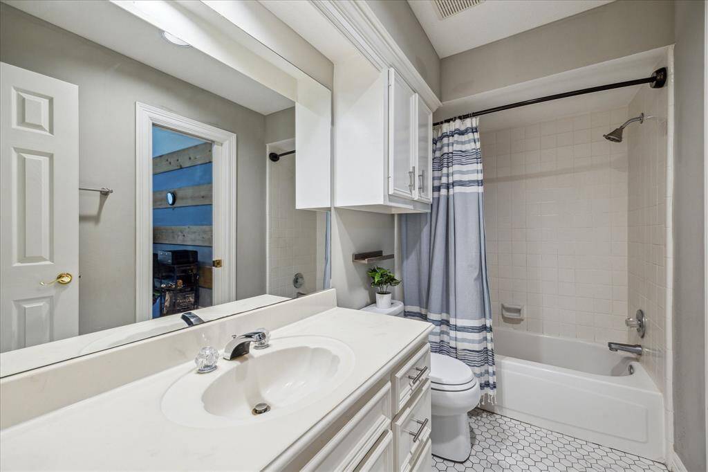 Bathroom that serves bedroom #2 and game room