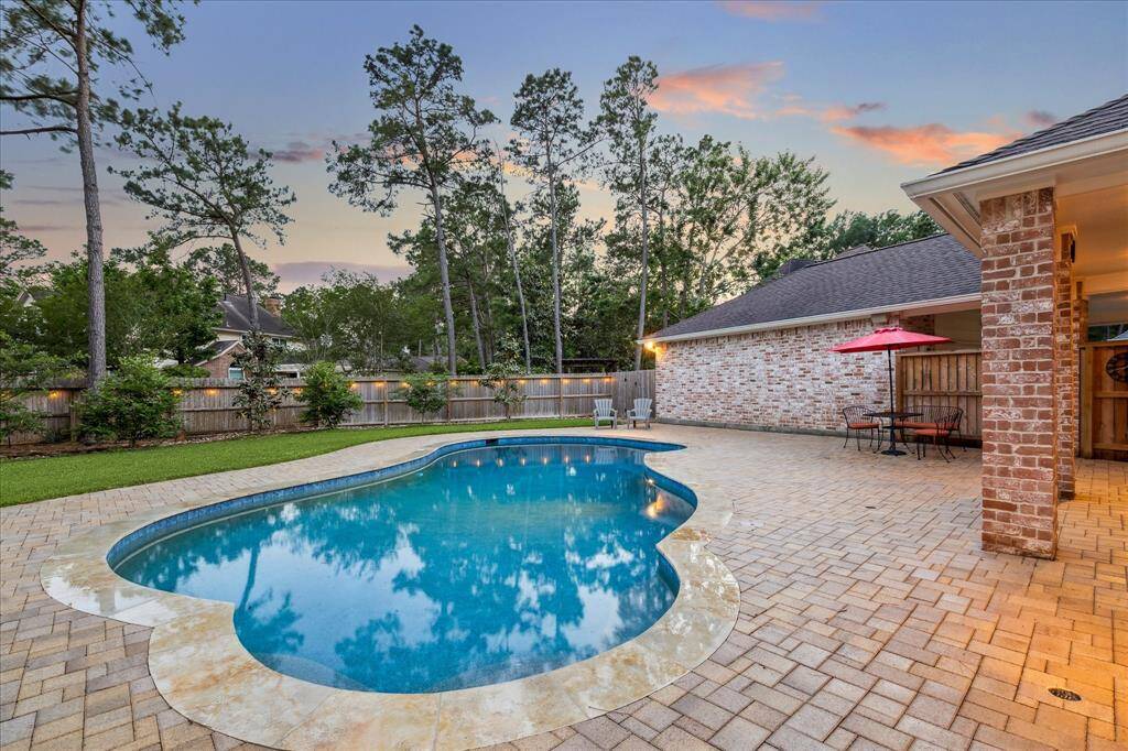 Enjoy gatherings with family and friends in this beautiful and generously sized backyard with inviting sparkling pool!