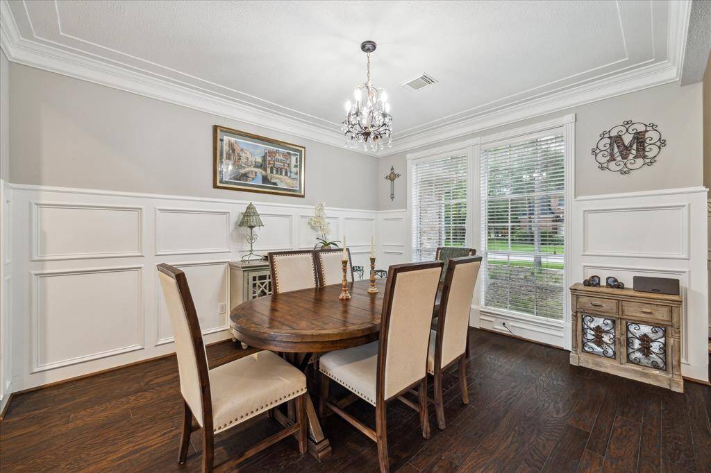 Beautiful formal dining area with wainscot accent