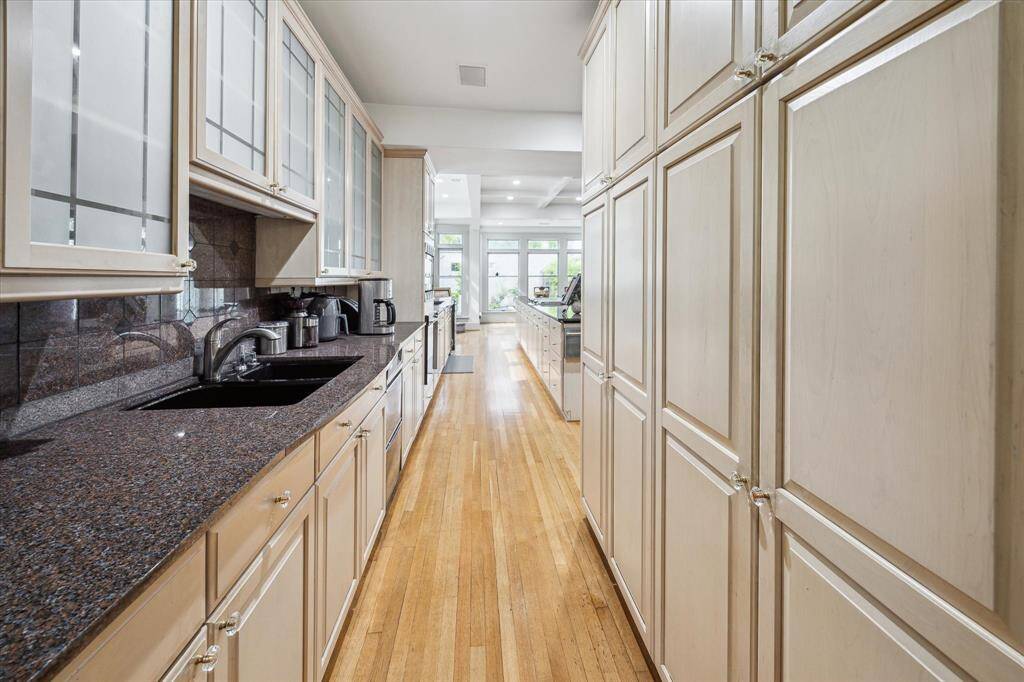 This area leads directly to the formal dining room...plenty of pantry space and a second sink. (there is currently a non-working ice maker, so easy enough to replace since the space is already there!)