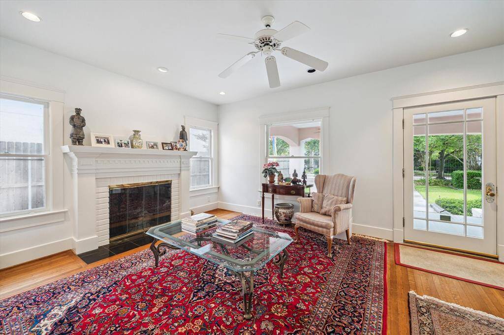 One of three gas log fireplaces is found in the formal living area, beautiful character in this formal room.