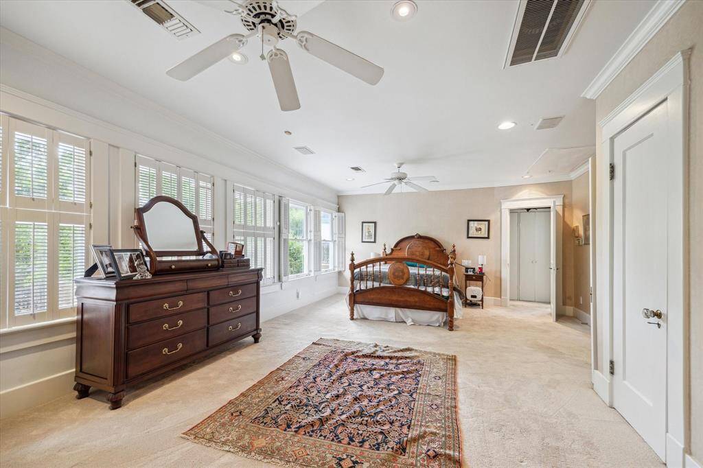 The primary bedroom is massive, spanning the whole front second story of the home. You'll find two cedar closets and one larger walk-in closet & windows equipped with wooden shutters.