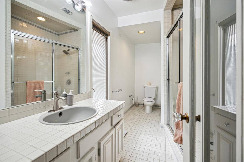 The seller just removed the wallpaper and had the primary bathroom fully painted. Next to this bathroom is a good size closet that one could potentially use to expand the primary bath.