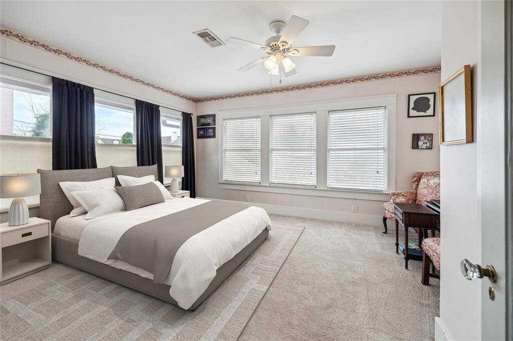 The third bedroom has lovely corner windows and enough room to accommodate a desk, large dresser or seating area. This photo has been virtually staged.