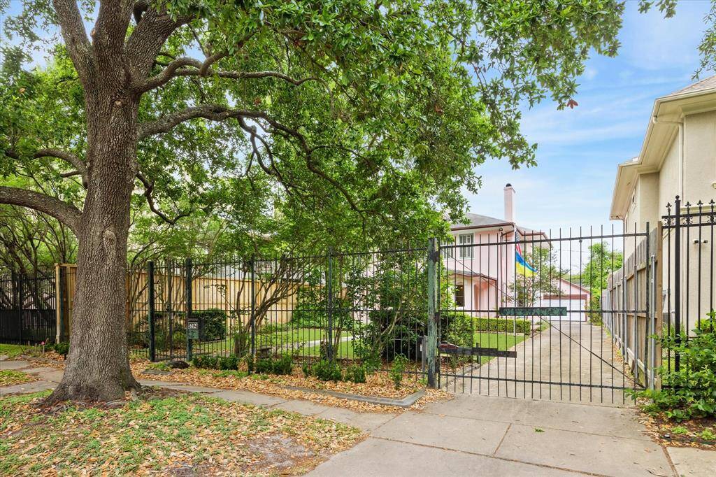 Fully fenced on the tree-lined street, plus an automatic driveway gate.
