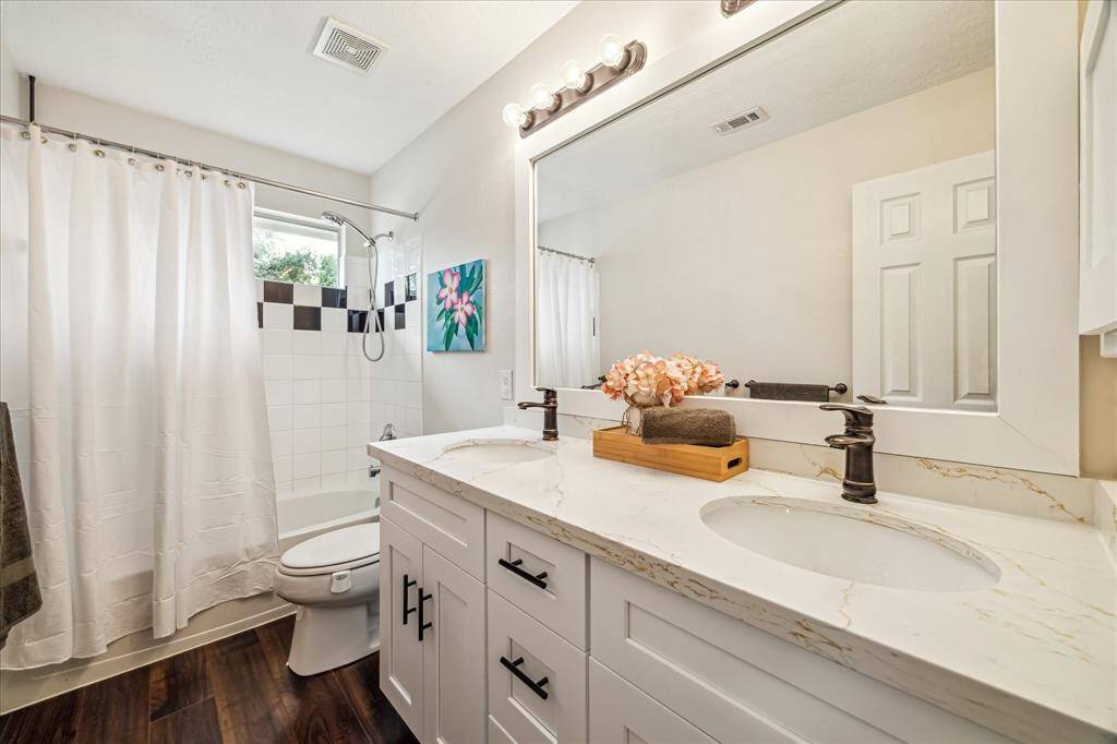 Updated full bath between bedrooms on second floor.