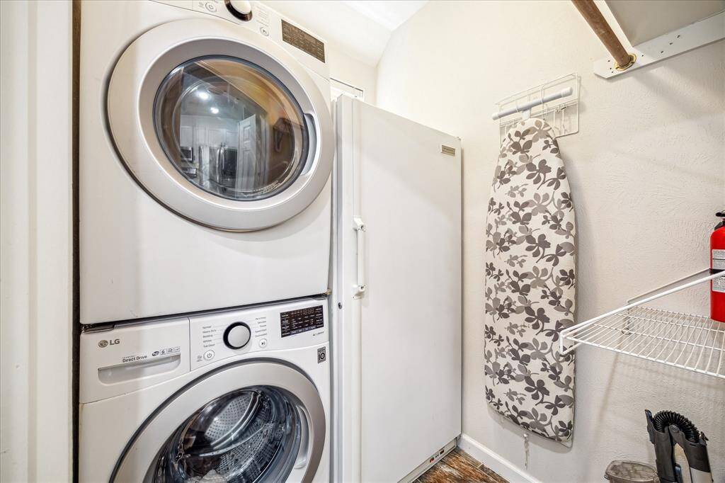 Laundry room with space for fridge .