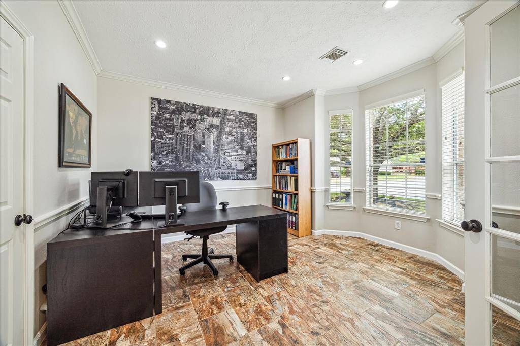 Front Office / Dining room.  Sellers added french doors to add flex space as either a formal dining room or an office.