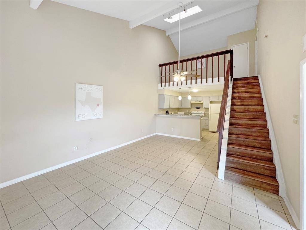 Step inside to soaring ceilings, an open layout filled with natural light