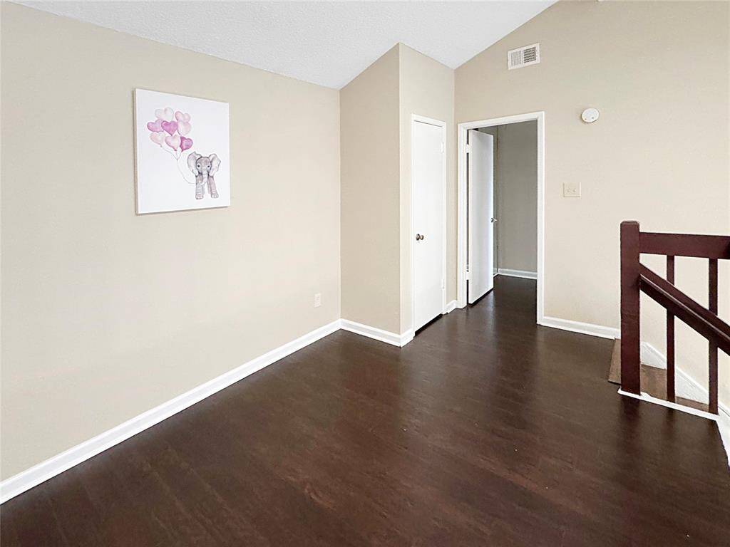 Upstairs offers versatile space ideal for an office or playroom.