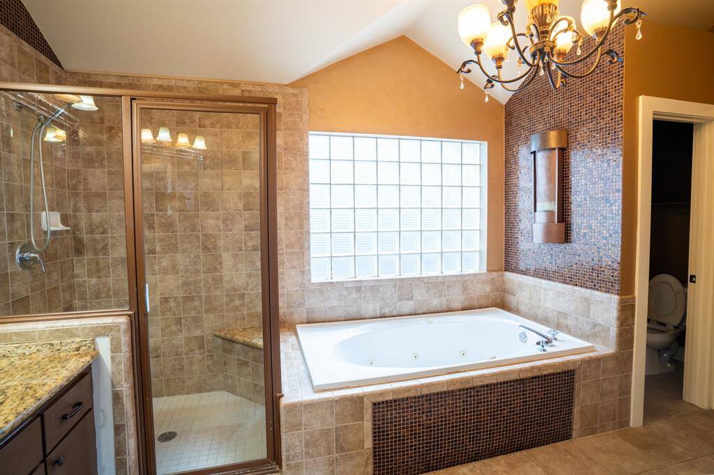 Primary bath tub and separate shower, large walk-in closet