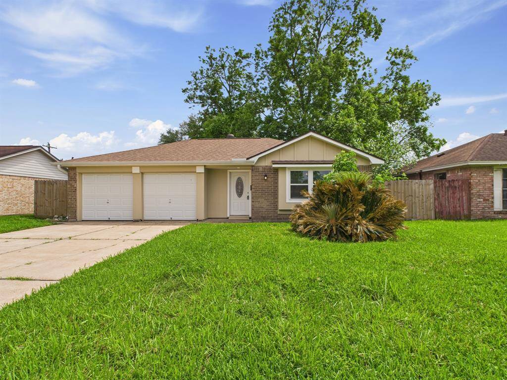 Charming single-story home with a clean, well-maintained exterior, featuring a two-car garage and a spacious front lawn.