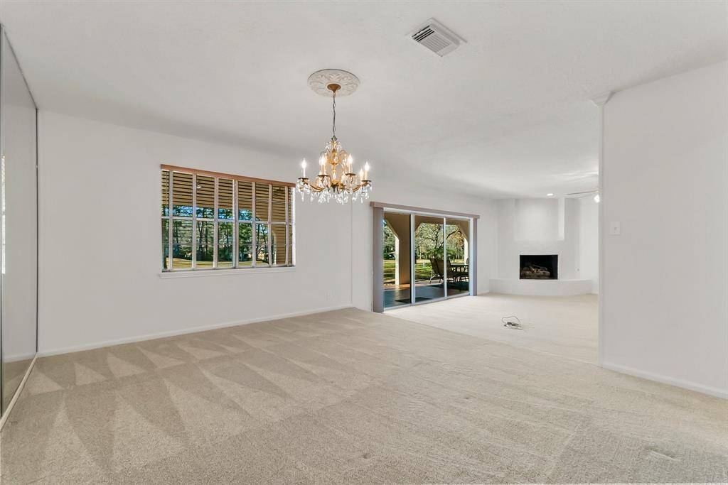 Open concept design seamlessly integrates the formal dining room and family room.
