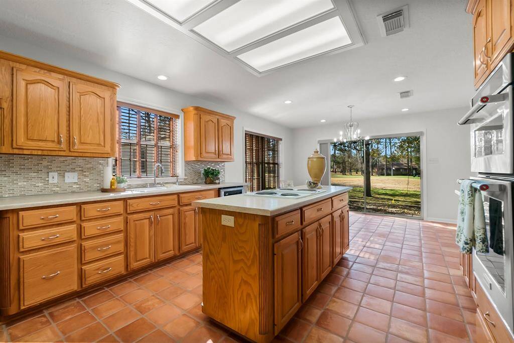 Kitchen countertops and backsplash updated.  Kitchen sink, faucet and hardware updated. Wall oven and microwave replaced. New chandelier in breakfast room. All handles/pull hardware replaced.