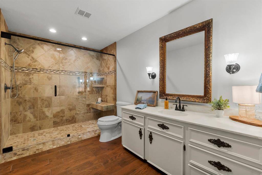 Bathtub was removed and LARGE walk-in handicap accessible shower w/ sitting area added. Flooring has been replaced.
