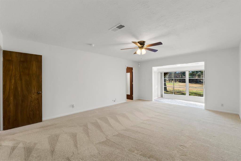 Primary room with custom window treatments.
