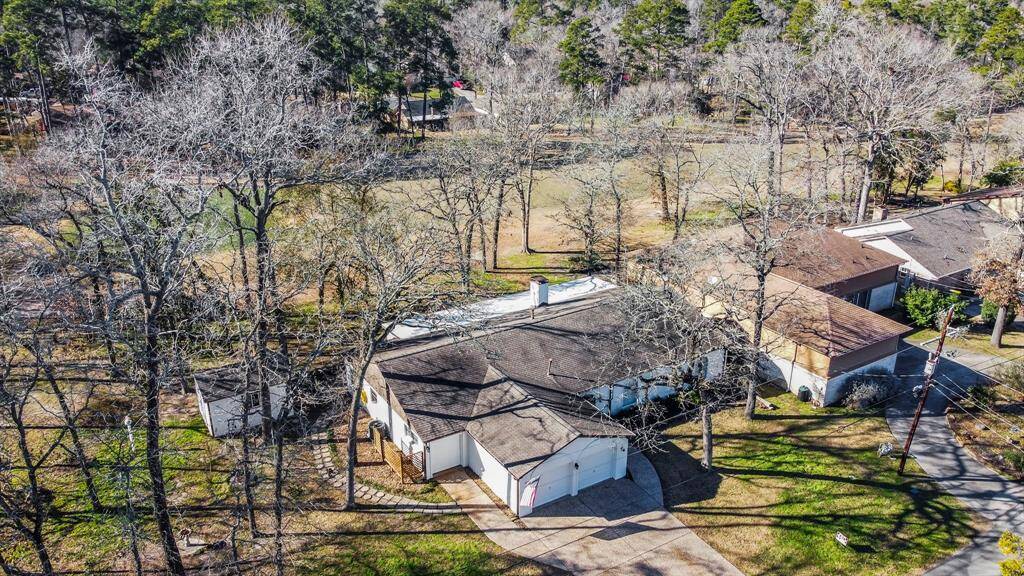 Aerial view showcasing the large lot size and golf course view.