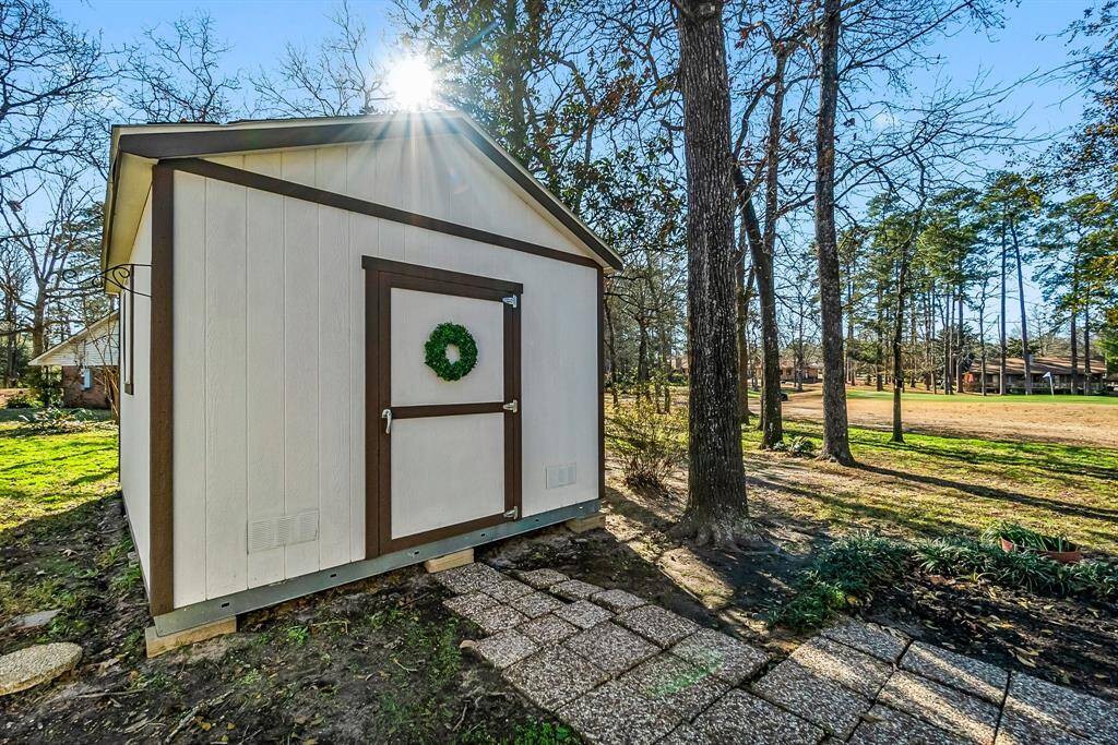 Custom TUFF shed to match the home with shingled roof.