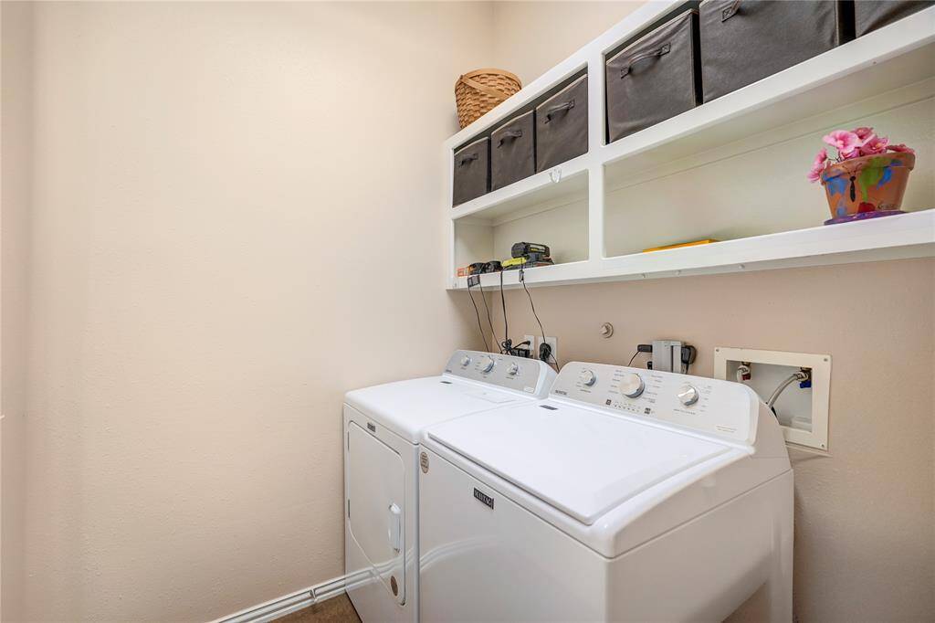Utility off the garage entrance -- plenty of storage - dryer can be electric or gas.
