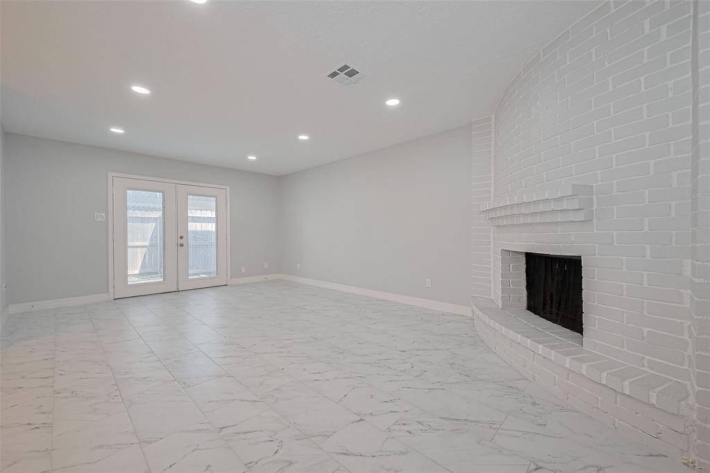 Massive living area, French door leads to back patio