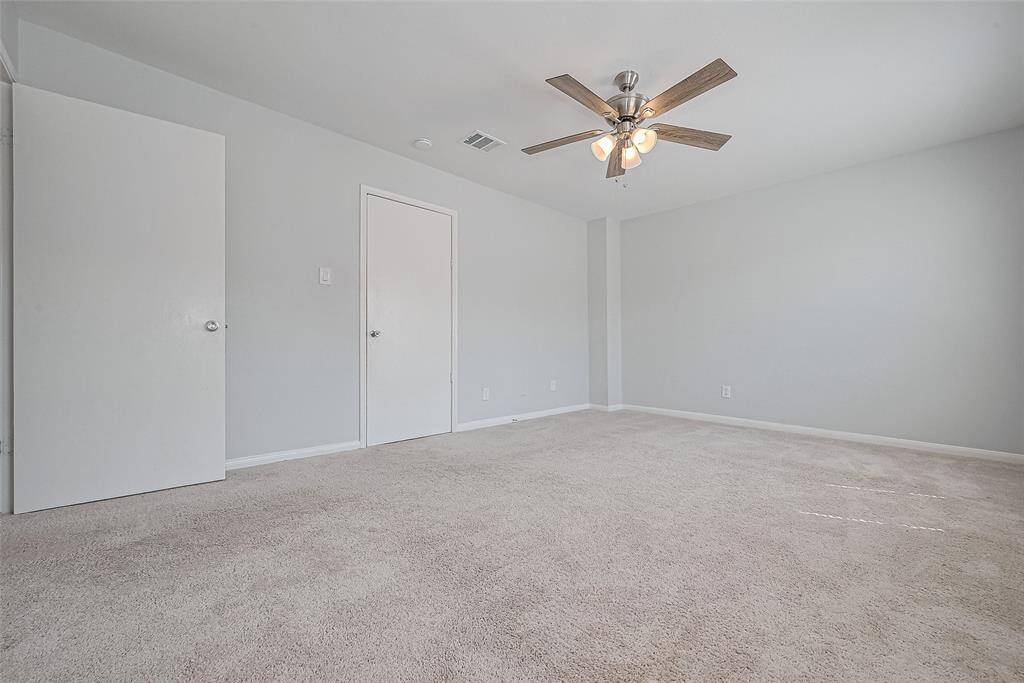 Another view of primary bedroom