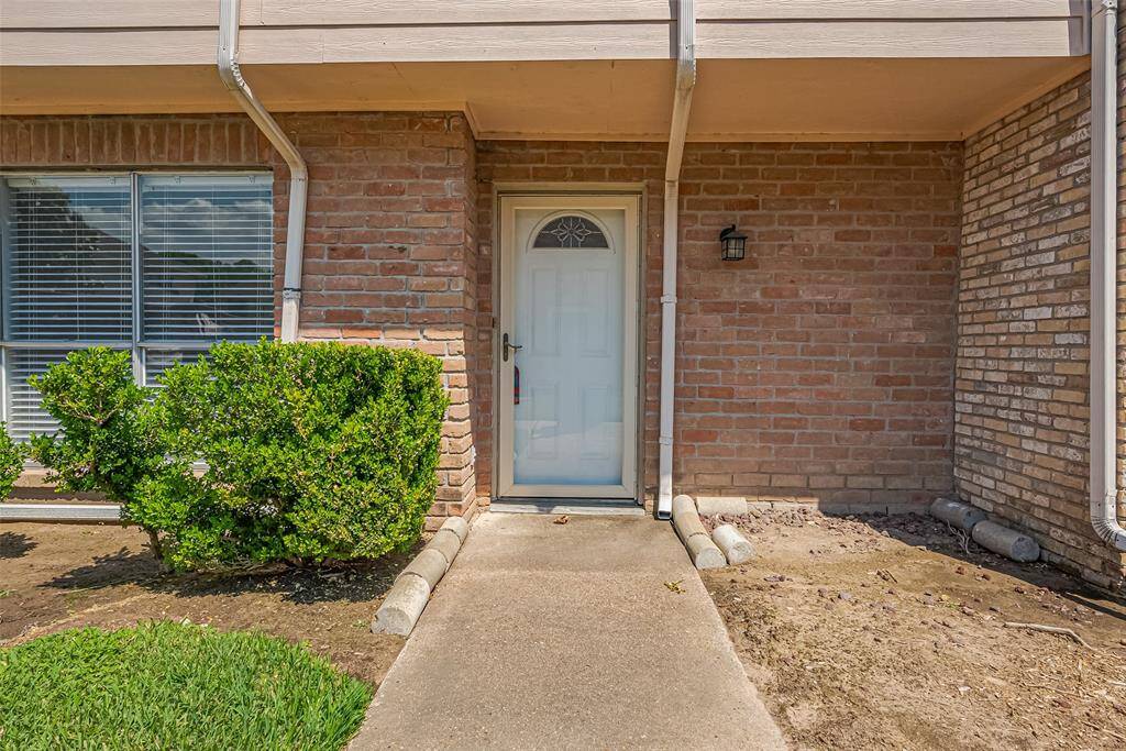 Main entrance feat. storm door.