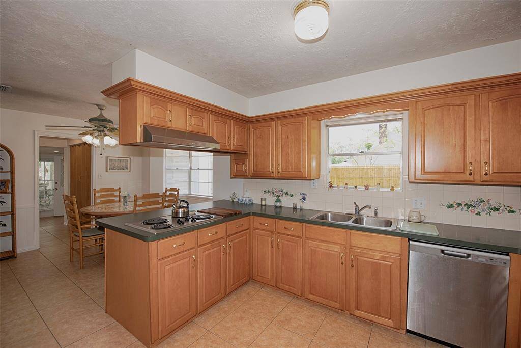 Another view of the kitchen with easy access to the casual dining area. Kitchen also features stainless appliances.