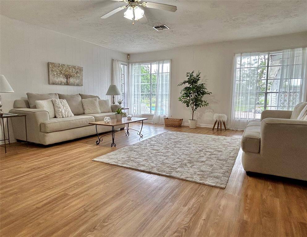 Family room provides plenty of space for large furniture and views of the gorgeous pool in the backyard.