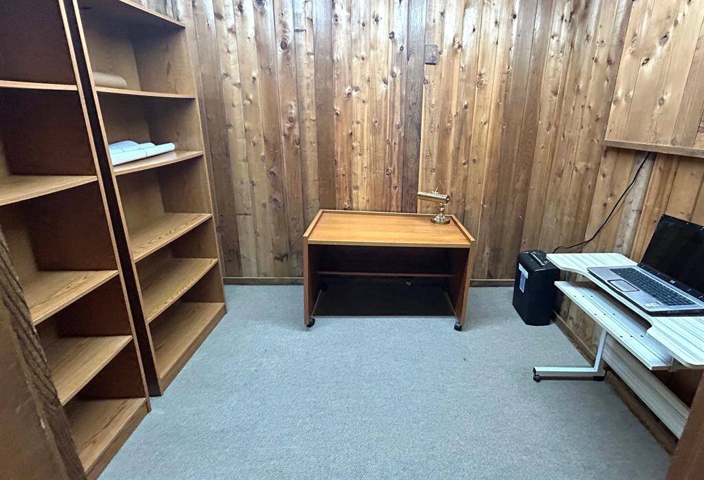 Office area located in the game room area offers a quite space to work and could also be used as a cedar closet if preferred.
