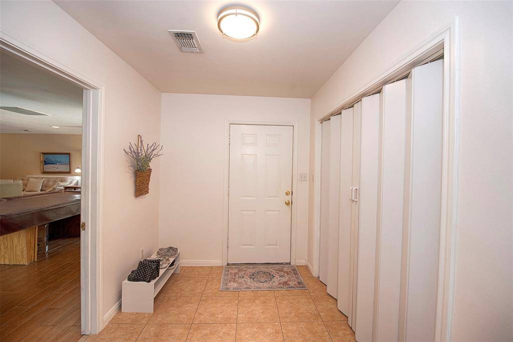 Between the sunroom and game room is a fabulous mud room with access to the garage.