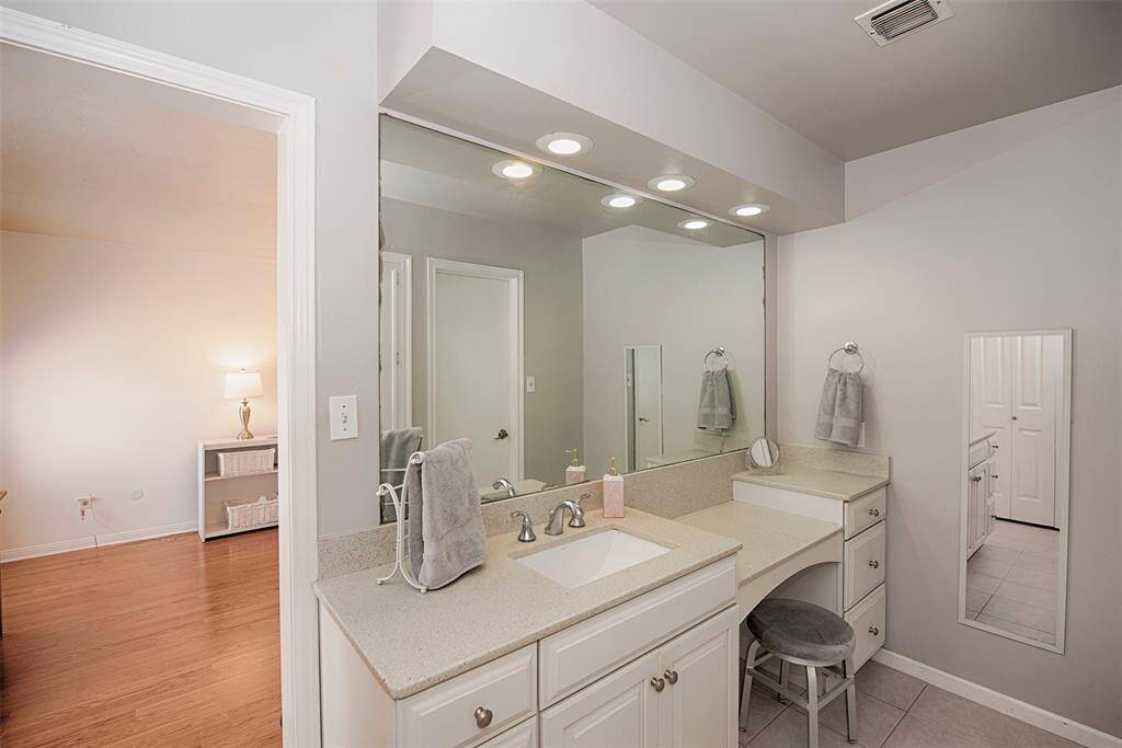 Amazing updated vanity with quartz counters.