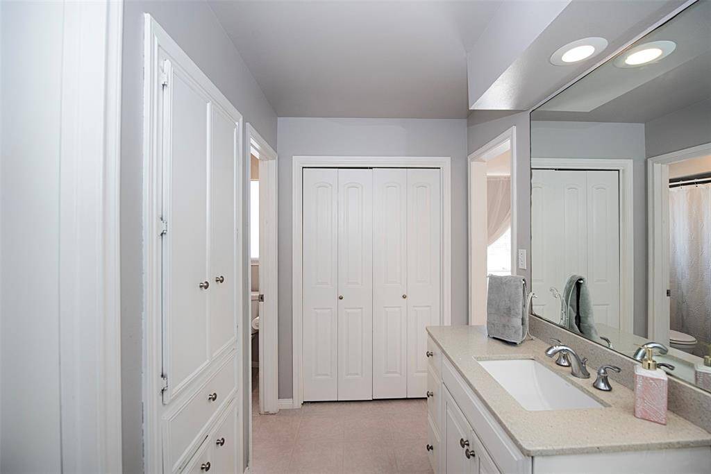 Primary bathroom also provides great storage with two closets and built in cabinetry for your towels, linens and bathing essentials.