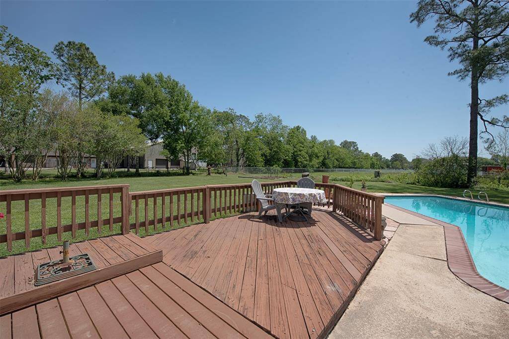 On the other side of the pool is a great deck for sunbathing or outdoor dining space.  There is also a 220 volt outlet for a hot tub!