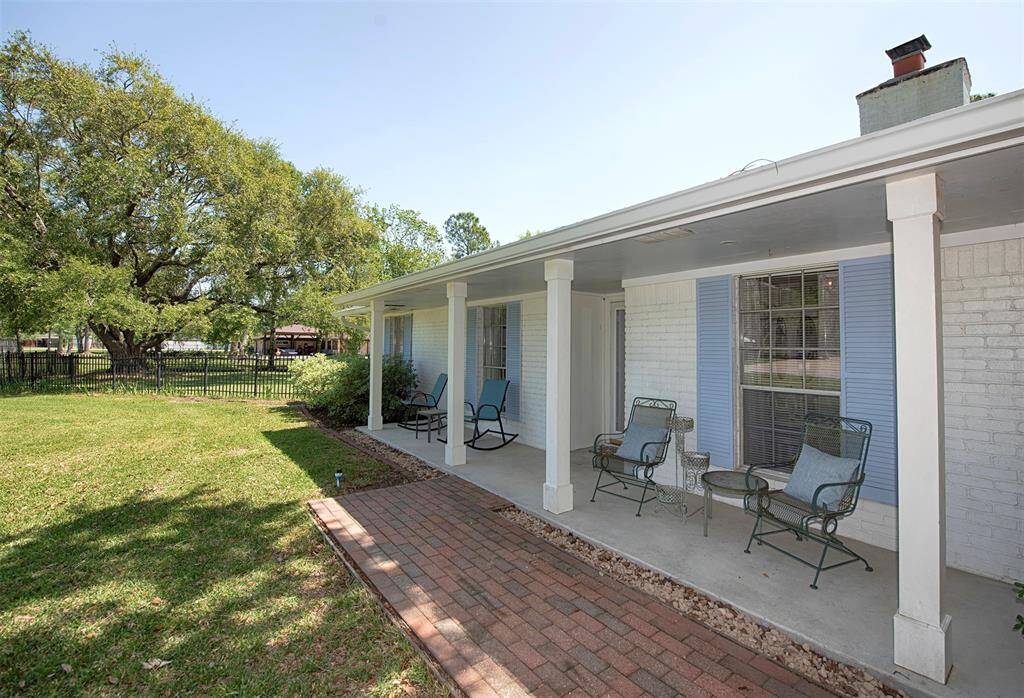 Fabulous front porch for enjoying an evening beverage or summer cool drink while watching the kids play.