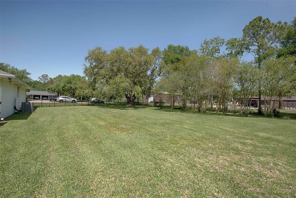 Along the side of the home is a tremendous yard area. Set up a volley ball net and imagine the great fun! Also could easily fit a playground area for the kiddos.