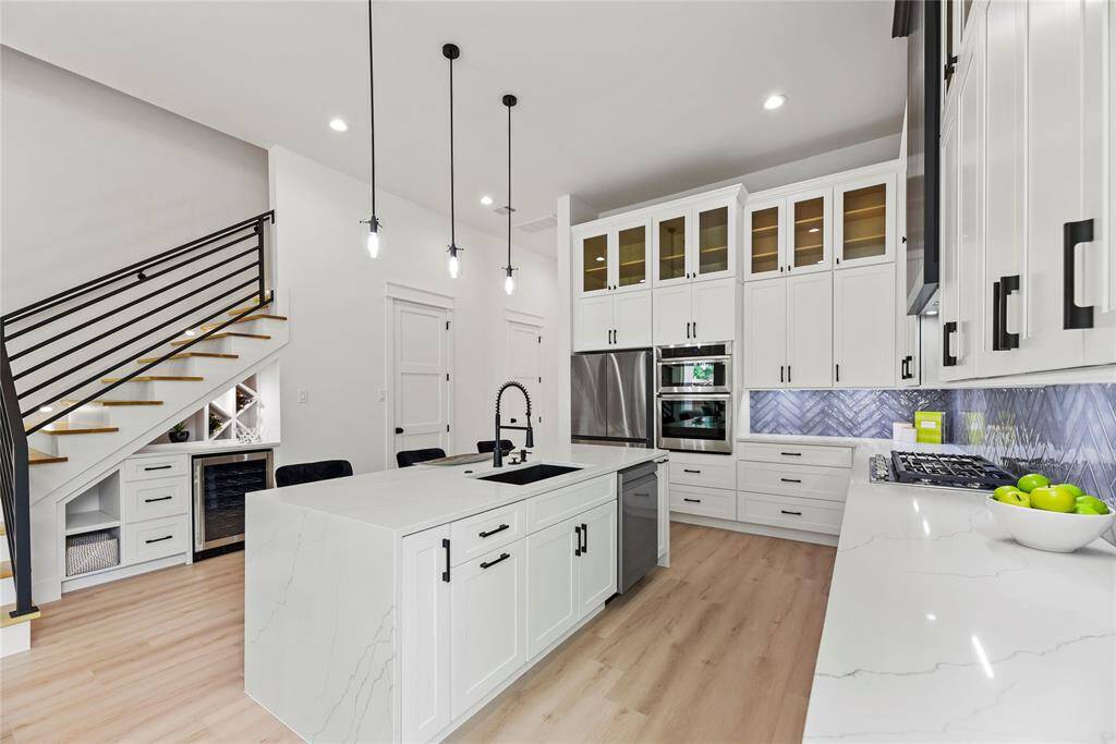 You and Your Family will love, love, love the custom quartz kitchen island-designed to impress with soft close cabinetry and drawers, full quartz waterfall edges, an upgraded sink & faucet and seamless integration of the dishwasher for both style and functionality.
