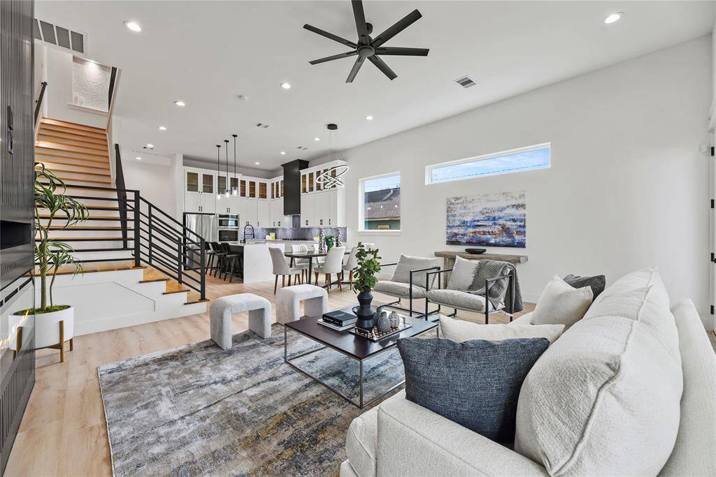 An abundance of LED recessed lighting and well-placed windows, ensuring a bright, airy ambiance throughout both day and night.