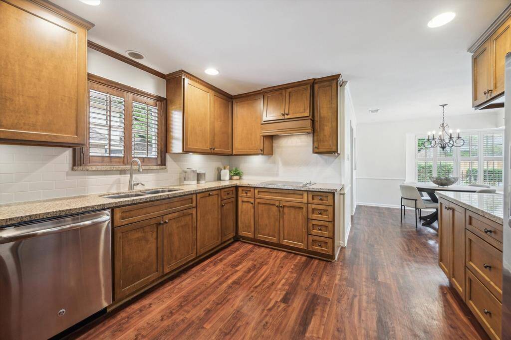 Kitchen updated approximately 10-15 years ago features stainless steel appliances, granite counters and solid cabinetry.