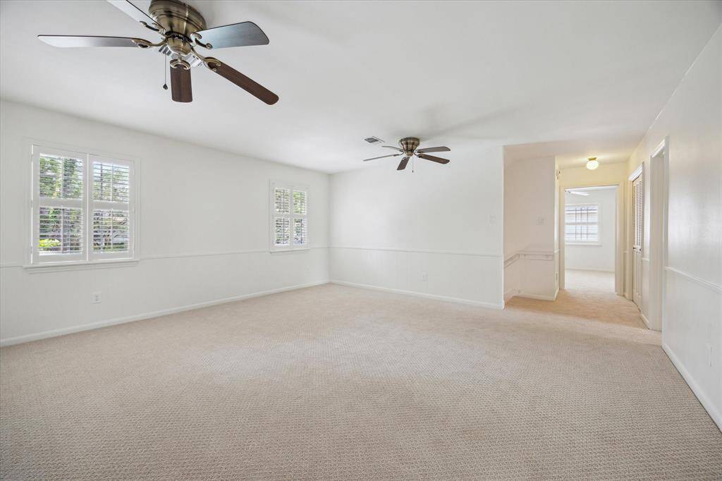 Upstairs guest bedroom with plantation blinds, fresh carpet and paint.