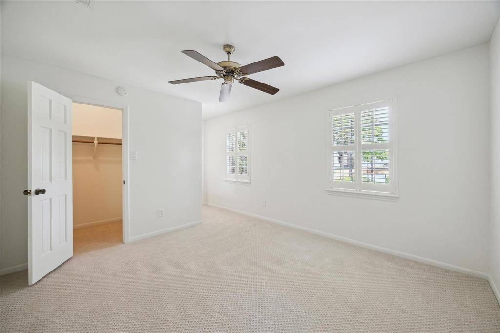 Upstairs guest bedroom with plantation blinds, fresh carpet and paint.