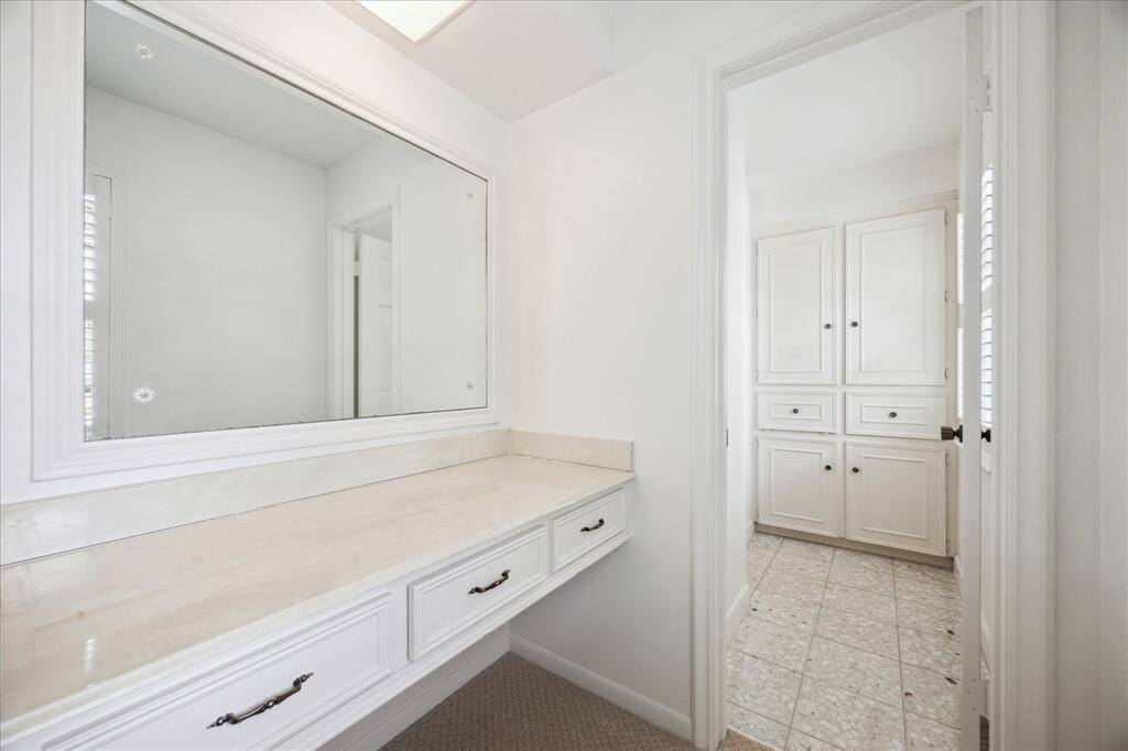 Tucked away vanity area in guest bedroom connecting to the bathroom.