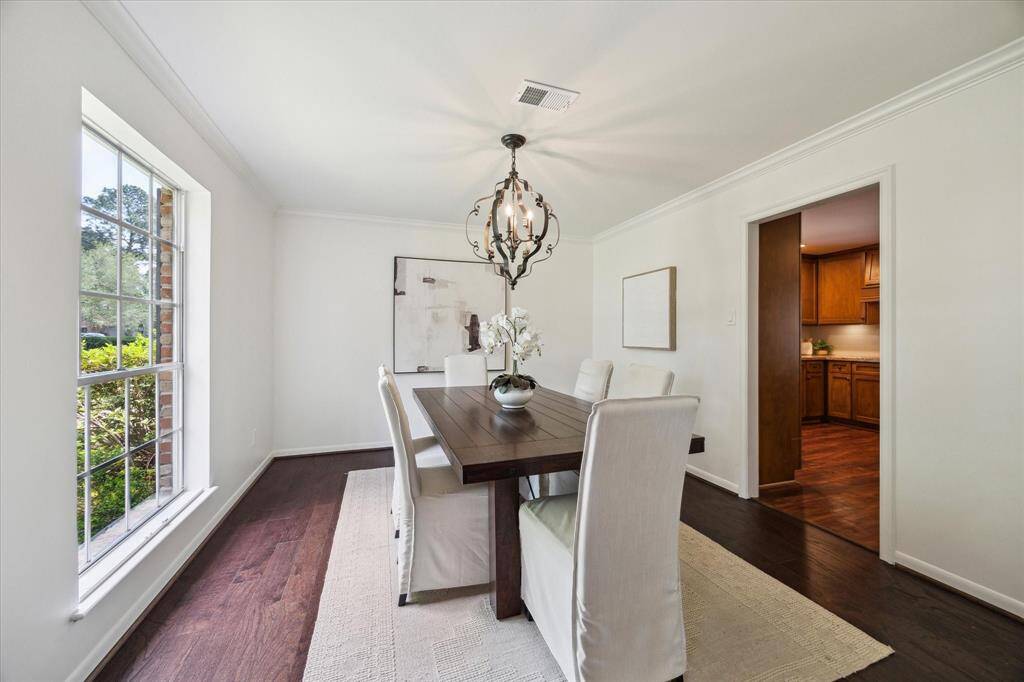 Formal dining room connecting to the kitchen and formal living room. Could also be used as a second home office, bar room or study.
