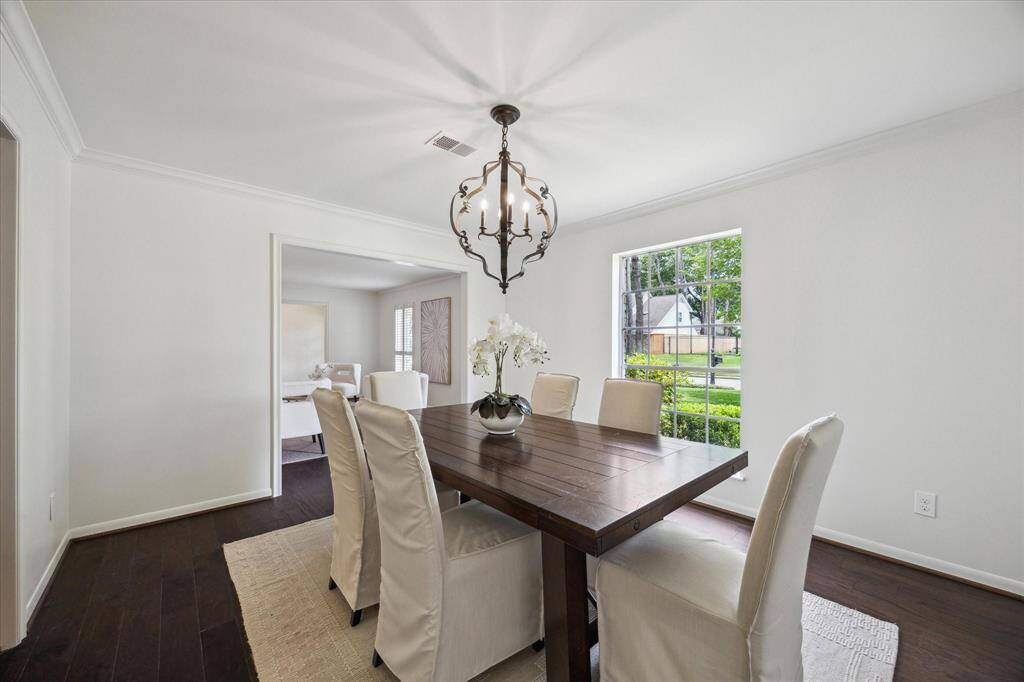 Formal dining room connecting to the kitchen and formal living room. Could also be used as a second home office, bar room or study.