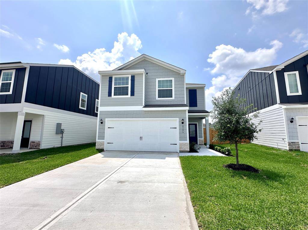 This beautiful two-story features a modern exterior design with beautiful LP siding and stone.
