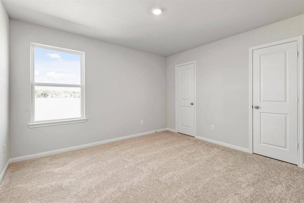 Even the secondary bedroom is spacious and full of natural light.